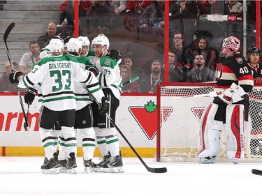 Colton Sceviour #22 of the Dallas Stars celebrates his first period goal against Robin Lehner #40 of the Ottawa Senators with teammates Alex Goligoski #33, Trevor Daley #6 and Antoine Roussel.