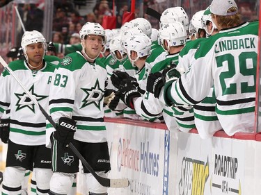 Ales Hemsky #83 of the Dallas Stars celebrates his first period power-play goal against the Ottawa Senators with teammates at the players' bench.