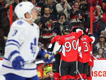 Dion Phaneuf of the Toronto Maple Leafs looks up at the clock after Erik Karlsson's second goal of the night for the Ottawa Senators during third period NHL action.
