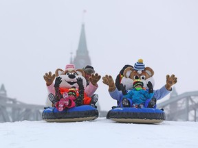 Emma (L) and Thomas Ouellet (R) have fun at the site of the Snowflake Kingdom for the 37th edition at Jacques-Cartier Park in Gatineau, January 07, 2015.