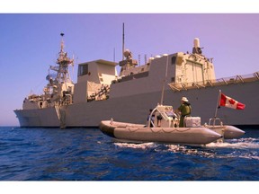 English/Anglais IS2003-2256a 06 April, 2003 HMCS Regina, Gulf of Oman, Arabian Gulf Region A Rigid Hull Inflatable Boat (RHIB) pulls alongside HMCS Regina in the Gulf of Oman. The Canadian frigate is part of Coalition Task Force 151, and is responsible for escorting ships, intercepting and boarding suspect vessels and guarding against attacks on shipping, in support of Operation Apollo, Canada's contribution to the international campaign against terrorism. Photo by MCpl Frank Hudec, Canadian Forces Combat Camera  French/Fran ais IS2003-2256a 6 avril 2003 NCSM Regina, golfe d Oman, r gion du golfe Arabo-Persique Un canot pneumatique   coque rigide aborde le NCSM Regina dans le golfe d Oman. La fr gate canadienne fait partie de la Force op rationnelle 151 de la coalition et est charg e d escorter les navires et de les d fendre contre des attaques, ainsi que d intercepter et d arraisonner les b timents suspects. Elle prend part   l op ration Apollo, la participation du Canada   la campagne internationale contre le terrorisme. Photo : Cplc Frank Hudec, Cam ra de combat des Forces canadiennes