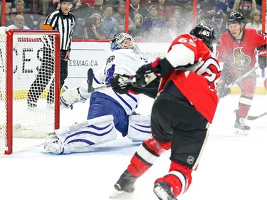 Erik Karlsson of the Ottawa Senators scores on James Reimer of the Toronto Maple Leafs during first period NHL action.