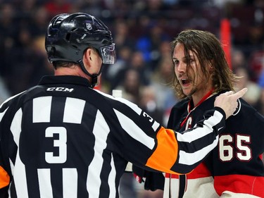 Erik Karlsson of the Ottawa Senators isn't pleased with his penalty as he talks to referee Mike Leggo during second period NHL action.