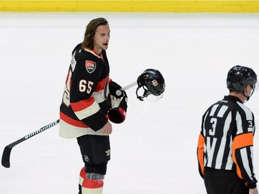 Ottawa Senators captain Erik Karlsson complains to the referee as he makes his way to the penalty box during second period NHL hockey action.