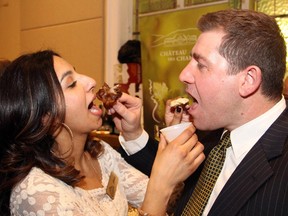 Event chair Tahera Mufti and Glebe restaurateur Nick Caravatta of The Urban Pear get creative while trying the food at the Taste in the Glebe fundraiser, held at the Glebe Community Centre on Thursday, January 22, 2015.