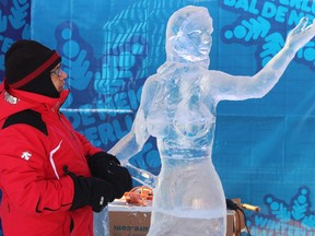 Evher Coronel, originally from Lima, Peru is competing in the ice sculpture competition.  (Emanuela Campanella/Ottawa Citizen)