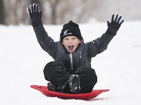 Ewan Eldridge takes advantage of the new snow at Hampton Park in Ottawa on Sunday, Jan. 4, 2015.