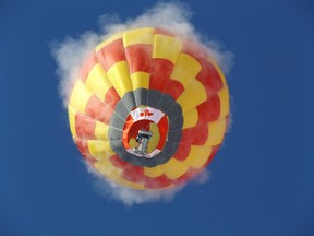 Steam rises from Sandra Rolfe's balloon as she lifts off  in extreme cold.