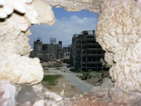Detail of Sniper’s Hole (from inside the 'Roum' [Orthodox] church), at the intersection at Place des Martyrs, Beirut, 1992, by Jayce Salloum.  (Chromogenic print, courtesy of the artist)