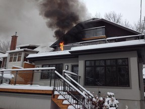 A blaze breaks out in a hot tub on the second-storey deck of a Broadway Avenue house in the Glebe Monday, Jan. 12, 2015.