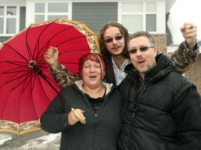 The Leduc family, from left Johanne, son Carlo Cote and Louis, was one of four families to get the keys to their new Habitat home last month.