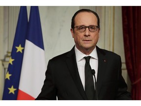 French President Francois Hollande delivers a speech at the Elysee Palace in Paris after a shooting at the Paris headquarters of satirical weekly Charlie Hebdo killing at least 12 people, Wednesday, Jan. 7, 2015.  M