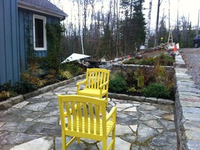 Jo Hodgson has incorporated a flagstone pathway-patio and planting beds in this garden in the Outaouais