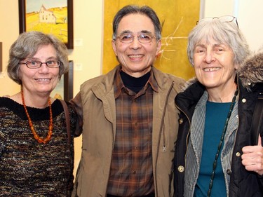 From left, Marion Takeuchi with her husband, artist Norman Takeuchi, and Canadian author Frances Itani at the vernissage for Cube art gallery's 10th anniversary exhibition, held Sunday, January 11, 2015.