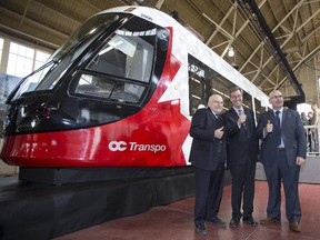 MP Royal Galipeau, Mayor Jim Watson and Ontario Transportation Minister Steven Del Duca helped introduce a fullsize replica of the light rail car that will be used in Ottawa.