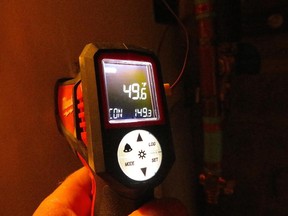 The lower number on this digital probe shows the internal tank temperature on an electric water heater. Tests show that overnight standby heat losses amount to about three degrees.