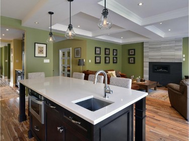 Coffered ceilings, tropical walnut floors and a large kitchen island were key in the redesign, which focused on open spaces and functionality.