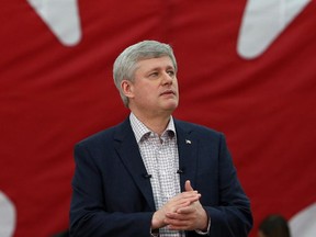 Prime Minister Stephen Harper delivers a speech to supporters at a high school in Ottawa, Sunday January 25, 2015.