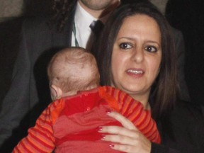 MP Sana Hassainia, then with the NDP but now an Independent MP, walks out of the House of Commons with her baby in 2012.