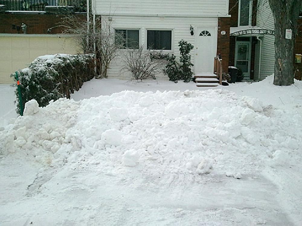 Driveway finally cleared after city plow blocks with street's snow