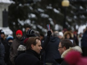 Hundreds of people gathered in Confederation Park in Ottawa in solidarity with the unity march in Paris, where an estimated 1.6 million people attended a rally to mourn the 17 people killed in the massacre at the Charlie Hebdo satirical weekly newspaper, on Jan. 11.