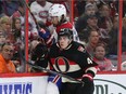 Jean-Gabriel Pageau gives his all against the Habs defender, Tom Gilbert.