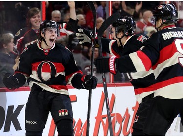 Jean-Gabriel Pageau, left, celebrates his goal in the first period with team mates Mark Stone and Milan Michalek.