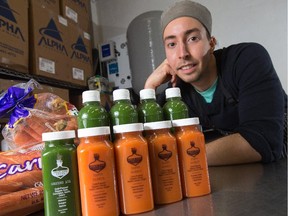 Justin Gauthier, co-owner of Urban Juice Press, prepares a batch of carrots for pressing. Justin has recently launched a new raw organic juice company that is in all Bridgehead locations and growing in a wholesale approach. Assignment - 119496 Photo taken at 15:13 on January 8. (Wayne Cuddington/Ottawa Citizen)