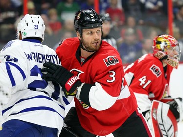 Marc Methot of the Ottawa Senators battles against James van Riemsdyk of the Toronto Maple Leafs during second period NHL action.