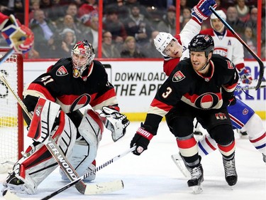 Marc Methot, right, keeps Brendan Gallagher away from Craig Anderson in the second period.