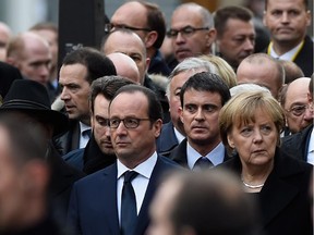 Francois Hollande, Manuel Valls and Angel Merkel are seen during a mass unity rally following the recent terrorist attacks on January 11, 2015 in Paris, France.