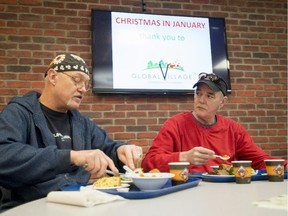 Mathew and Bruce have lunch at the Ottawa Mission during Christmas in January, a luncheon provided by Global Village Champions Foundation and the McLean Law Group in Ottawa on Wednesday, Jan. 28, 2015.