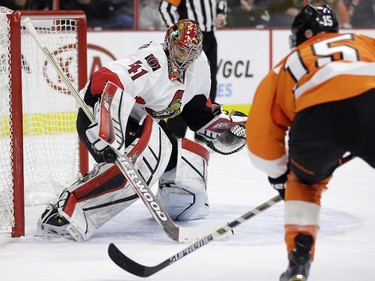 Ottawa Senators' Craig Anderson (41) blocks a shot by Philadelphia Flyers' Michael Del Zotto (15) during the second period.