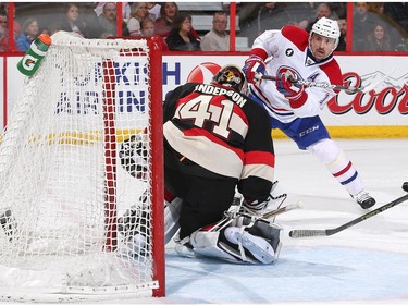 Craig Anderson #41 of the Ottawa Senators makes a save on a power play scoring chance against Tomas Plekanec #14.