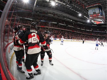 Jean-Gabriel Pageau #44 of the Ottawa Senators celebrates his first period goal against the Montreal Canadiens with teammates including Jared Cowen #2.