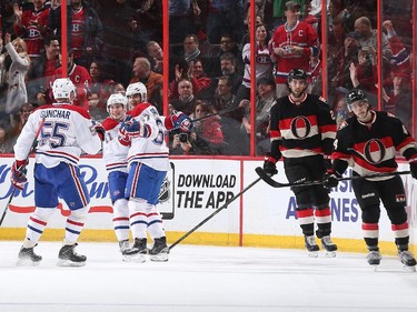Max Pacioretty #67 of the Montreal Canadiens celebrates his first period goal with teammates Sergei Gonchar #55 and Brendan Gallagher #11 as Jared Cowen #2 and Jean-Gabriel Pageau #44 of the Ottawa Senators react on the play.