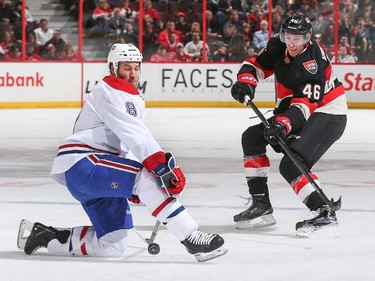 Patrick Wiercioch #46 of the Ottawa Senators shoots the puck past Brandon Prust #8.