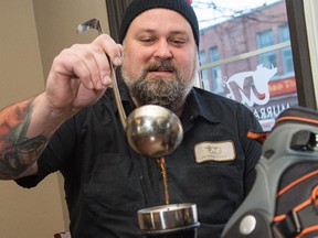 Chef Steve Mitton pours broth into a Thermos at Murray Street Restaurant.