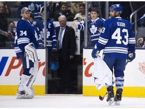 Toronto Maple Leafs forward Nazem Kadri (43) looks back after picking up a Maple Leafs jersey that a fan threw on the ice after being defeated buy the Washington Capitals during third period NHL hockey action in Toronto on Wednesday, January 7, 2015.