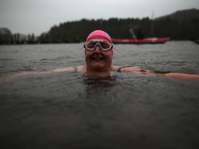 Swimmers take a dip in the icy waters of Lake Windermere during a charity swim to welcome in the New Year at Lake Windermere on January 1, 2015 in Windermere, England. The swim, organised by Sleekerswim, saw novice and veteran wild water swimmers plunge into the lake during heavy rain and high winds to raise cash for charity and welcome 2015.