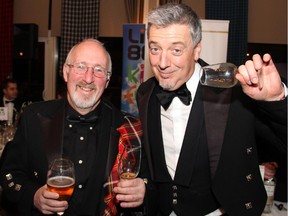 Organizer Michael Cox with radio personality Katfish Morgan from Live 88.5 and his empty whisky glass at the Robbie Burns Supper for Roger's House held Saturday, January 24, 2015, at the Ottawa Hunt and Golf Club.