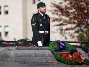A soldier stands guard at the National War Memorial during a ceremony at the memorial last Oct. 24, two days after Cpl. Nathan Cirillo was gunned down while on sentry duty at the memorial.