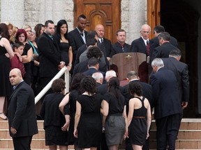 OTTAWA, ON: JULY 13, 2010 -- Pallbearers carry the casket of Tony El-Kassis into the St. Elias Antiochian Orthodox Church in Ottawa on Tuesday, July 13, 2010. El-Kassis -- who operated a chip truck in Richmond -- died last week, 6 days after after being slammed into a wall by a woman driving a Jeep. That woman, Rachelle Denis, is now facing a 2nd-degree homicide and other charges. Ridgewood Ave. at Riverside Dr.    PLEASE WITHHOLD NAME OF PHOTOGRAPHER AT HIS REQUEST    (photo by MIKE CARROCCETTO / THE OTTAWA CITIZEN)   (for CITY / WEB story by CLAIRE BROWNELL) NEG# 100654