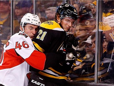 BOSTON, MA - JANUARY 3:  Patrick Wiercioch #46 of the Ottawa Senators battles Loui Eriksson #21 of the Boston Bruins in the third period at TD Garden on January 3, 2015 in Boston, Massachusetts.