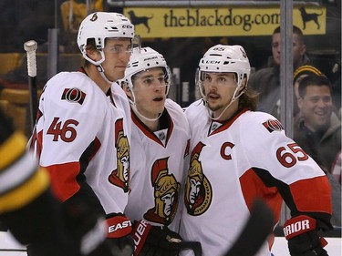 BOSTON, MA - JANUARY 3:  Kyle Turris #7 of the Ottawa Senators celebrates his goal with Patrick Wiercioch #46 and Erik Karlsson #65 in the second period at TD Garden on January 3, 2015 in Boston, Massachusetts.