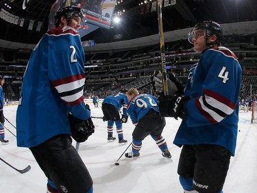 Nick Holden #2 and Tyson Barrie #4 of the Colorado Avalanche warm up prior to facing the Ottawa Senators.