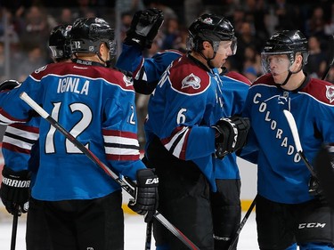Erik Johnson #6 of the Colorado Avalanche celebrates his goal against the Ottawa Senators with Jarome Iginla #12 and Alex Tanguay #40 of the Colorado Avalanche to take a 3-1 lead in the second period at Pepsi Center on January 8, 2015 in Denver, Colorado.