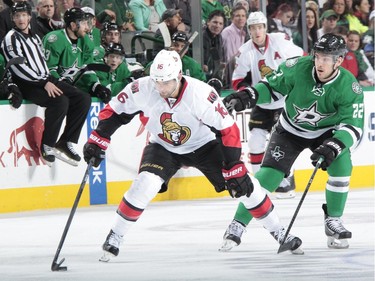 Clarke MacArthur #16 of the Ottawa Senators handles the puck against Colton Sceviour #22 of the Dallas Stars at the American Airlines Center on January 13, 2015 in Dallas, Texas.