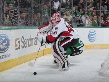 Robin Lehner #40 of the Ottawa Senators handles the puck against the Dallas Stars at the American Airlines Center on January 13, 2015 in Dallas, Texas.