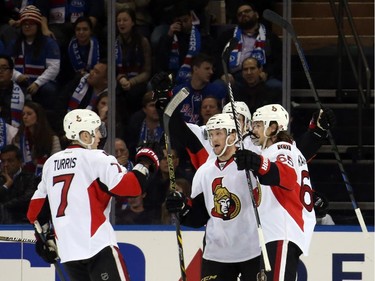 Erik Karlsson #65 of the Ottawa Senators celebrates with his teammates after scoring a goal in the second period.